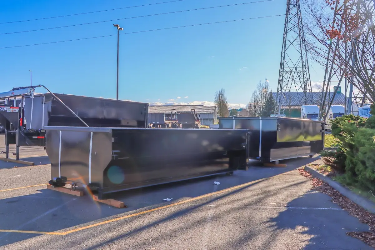 Roll-off dumpster ready for waste disposal at job site for 3 Yard Dumpster Rental in Bacliff